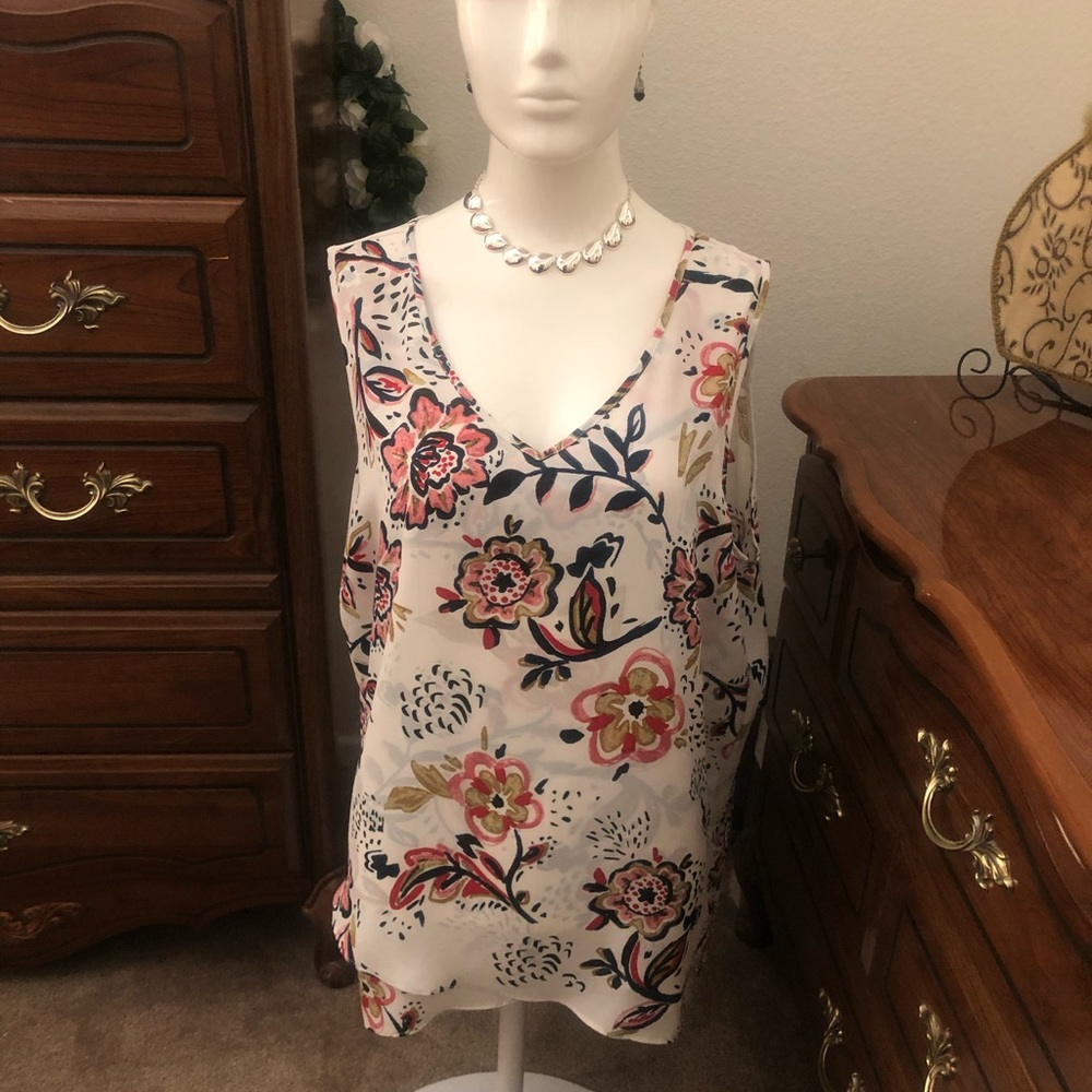 NWT Sleeveless blouse with crossover bottom and longer back.  See desc.